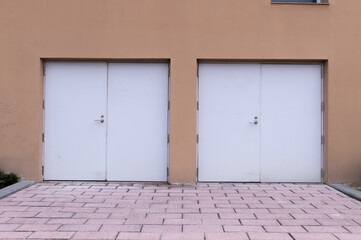 sidewalk by street wall and door