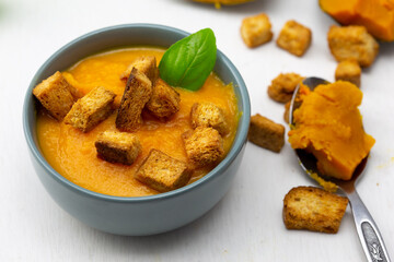 Pumpkin soup served with croutons