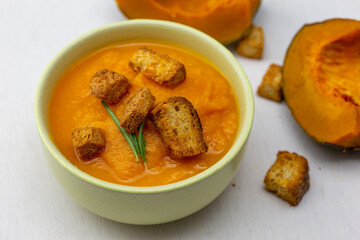 Pumpkin soup served with croutons