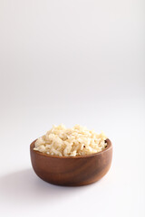 Organic boiled brown rice on bowl in close up