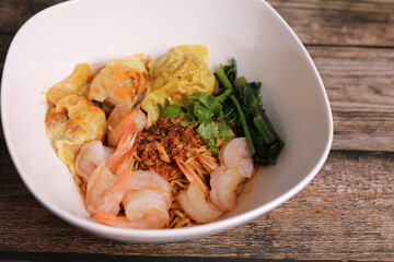Shrimp dumpling with shrimp on wood background