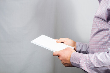 young guy holding a notepad