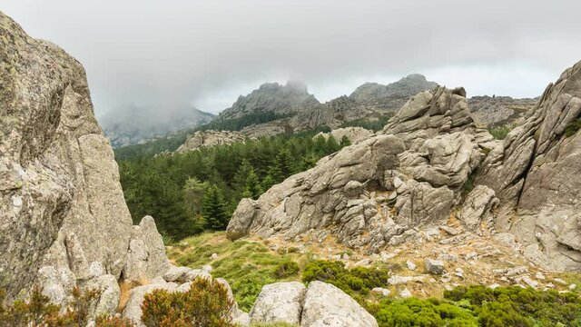 Timelapse view of clouds passing over the rocky top of Monte Limbara in Sardinia, Italy