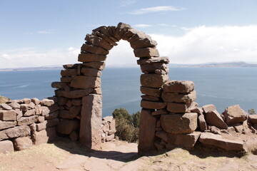 Famous typical stone arch from the uru people buildings from the titicaca lake in south america in...