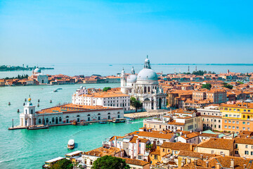 Venice old historical centre with buildings with red tiled roofs, churches and bell tower, Italy