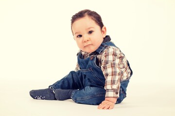 baby sitting with denim clothes