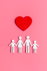 Family wooden figure and heart shape. Life insurance concept