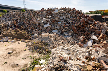 Loads of rubble at a landfill on a sunny summer day