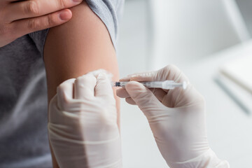 Cropped view of doctor doing vaccination of patient