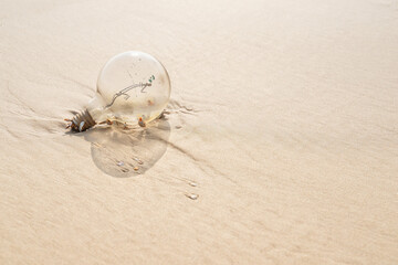 Old lamp With rust on a beach.