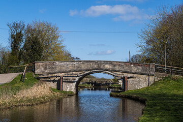 Canal lock seen through a bridge
