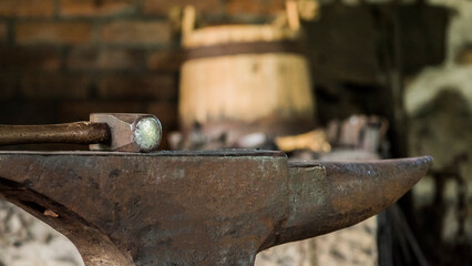 Inside an old forge anvil and hammer