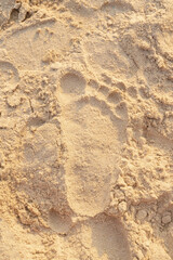Beach sand footprint ocean coast sea. Close-up.