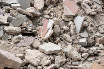 Closeup of pieces of broken tiles and rubble