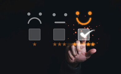 Businessman touching and doing mark to select smiley face with five yellow stars on black...