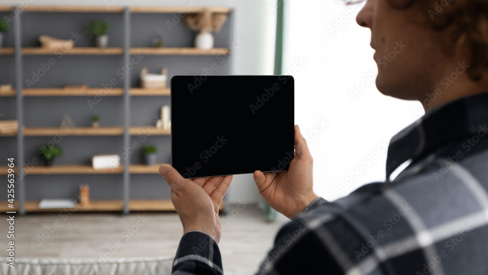 Poster Man Holding Tablet With Empty Screen Standing At Home, Mockup