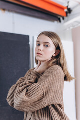 Portrait of young emotional blond caucasian girl in studio on background. Natural beauty, no make up concept