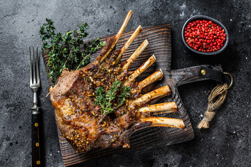 Barbecue rack of lamb meat chops. Black background. Top view