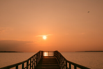 Fototapeta premium golden sunrise above the bay