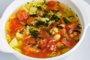 Tomato soup with beans and spices. Delicious vegetarian soup.
