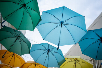 Fototapeta na wymiar Street decorated with colored umbrellas. view of Umbrella Street.