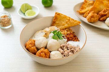 spicy small flat rice noodles with fish balls and shrimp balls without soup