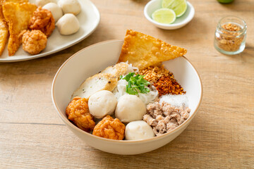 spicy small flat rice noodles with fish balls and shrimp balls without soup