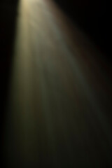 
flare of light on a black background. abstract spotlight background