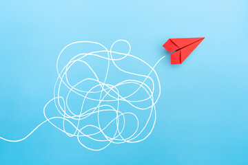 Business for solution concept. red paper plane on blue background