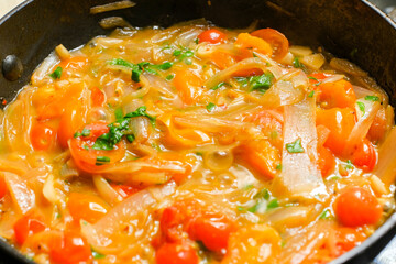 Red cherry tomatoes sauteed with onions shallot and garlic