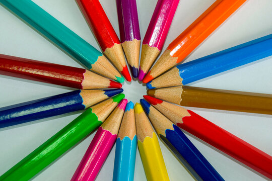 set of colored pencils on a white background. group work. pencils lie in a circle