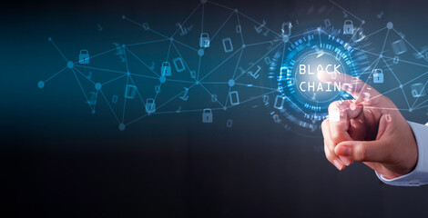 Blockchain technology concept, Businessman using finger touch  Blockchain text in technology circle , Binary code with connect digital technology line blue background.