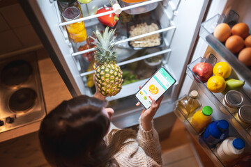 Woman ordering food online using a smart phone app