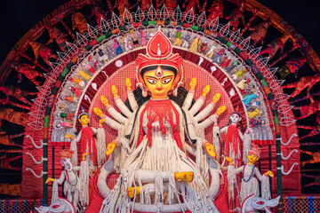 Idol of Goddess Devi Durga at a decorated puja pandal in Kolkata, West Bengal, India. Durga Puja is...