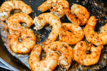 Shrimp buttered in a cast iron skillet