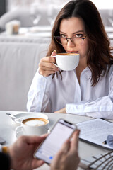 portrait of business lady attentively listen to colleague in restaurant