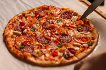 Cutting pizza with a knife