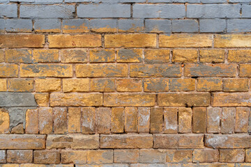 Texture background for the design of yellow brick and stone wall. Background of an old brick wall.