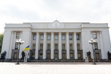 the main entrance to the building of the Ukrainian parliament with columns.national coat of arms of...