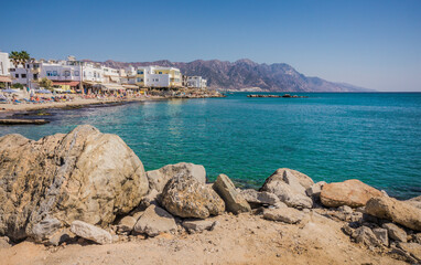 Fototapeta premium Rocks on beach of Kardamena resort. Kos island, Greece.