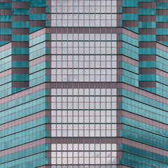 Fototapeta premium Geometric architectural abstract of colorful modern office building tower