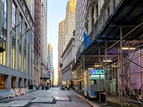 Empty View Of The Historic Buildings Along Wall Street With No People And A Lonely Food Cart In The Financial District Of Manhattan, New York City