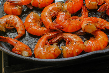 Shrimp buttered in a cast iron skillet