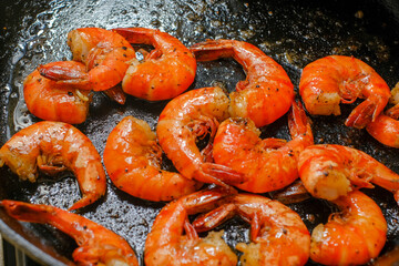 Shrimp buttered in a cast iron skillet