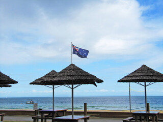 Moreton Island Beach with the Australian Flag Fluttering, Brisbane, Queensland, Australia