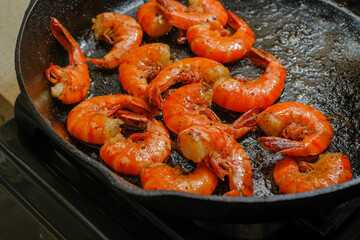 Shrimp buttered in a cast iron skillet