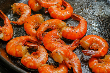 Shrimp buttered in a cast iron skillet