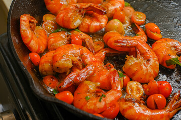 Shrimp buttered in a cast iron skillet