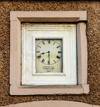 Stroud Time clock referring to the time when Stroud time was 9 minutes behind GMT until the railways arrived, Nailsworth, The Cotswolds, England