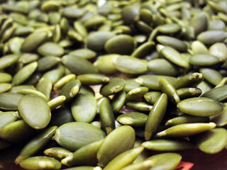 Green pumpkin seeds on a plate